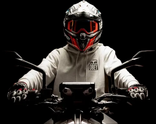 A fully equipped rider on a motorbike